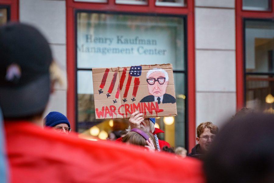 Activists protest against NYU hosting an event at Stern featuring former Secretary of State Henry Kissinger. (Photo by Tony Wu)