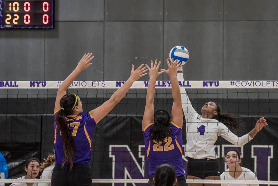 Nazzarine Waldon spikes the ball in a home win over Hunter College on the team’s Senior Day. (Photo by Sam Klein)