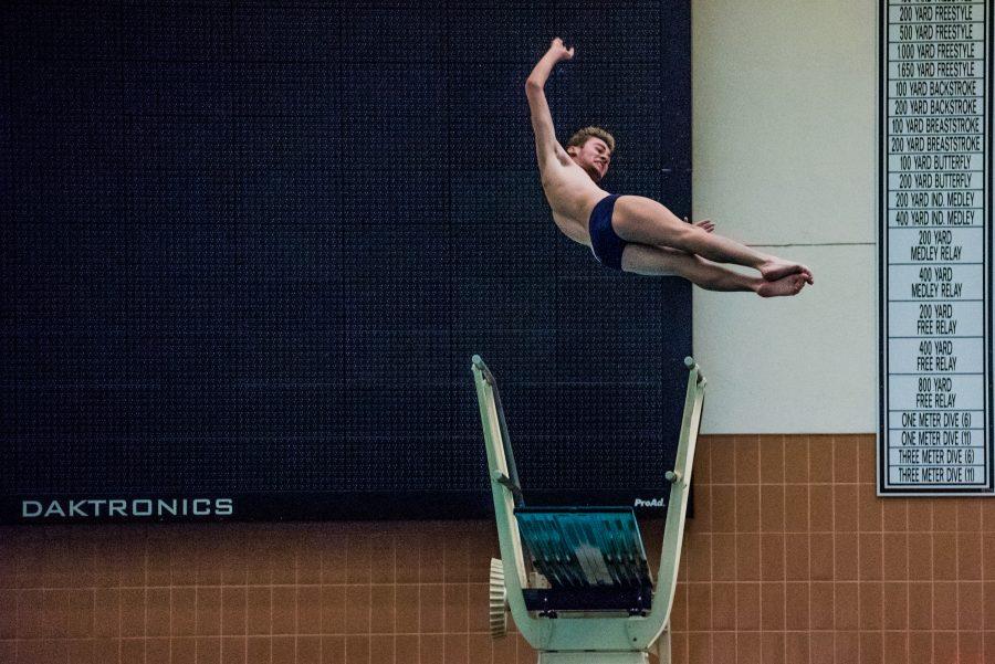First-year Cole Vertin dives in a win against West Chester University of Pennsylvania on Oct. 6. (Photo by Sam Klein)