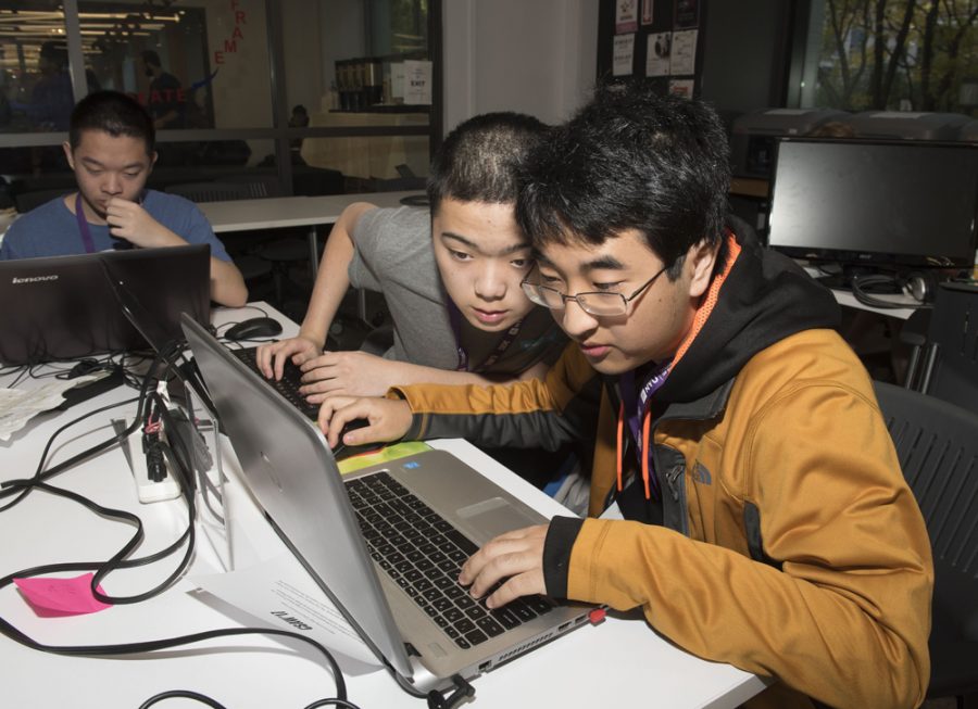 Two participants of the 2017 Cyber Security Awareness Week hackathon. (via csaw.engineering.nyu.edu)