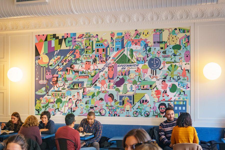 The new mural in The Village Den. Lisle Richards says “the new one is a nod to the old Village Den.” (Photo by Tony Wu)
