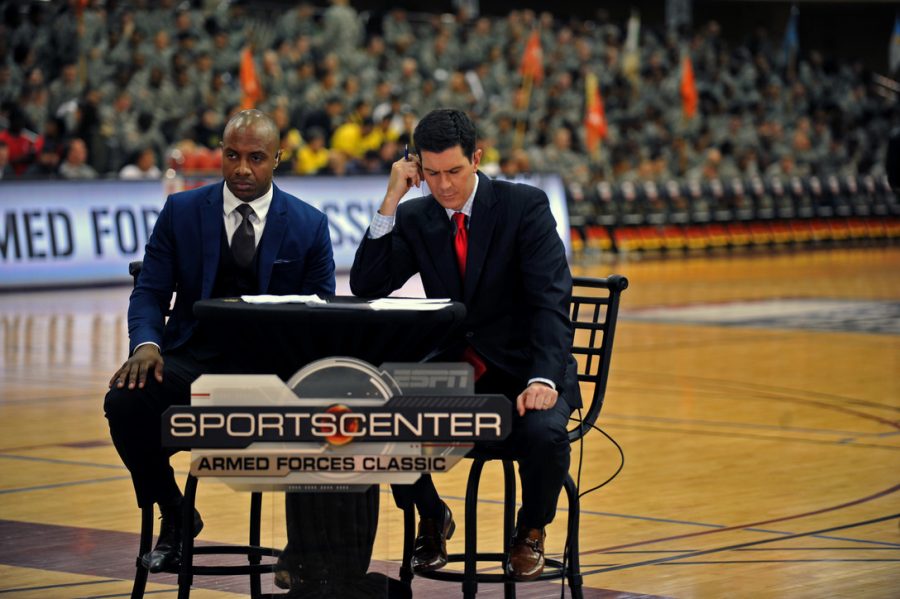 Jay Williams and Kevin Connors, ESPN college basketball commentators, wait to go live. A new ranking system for college basketball has been adopted in an effort to improve accuracy. (via osan.af.mil)