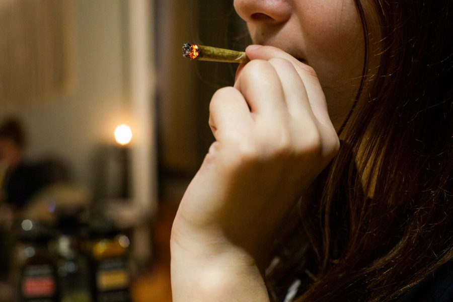  Student smokes a lit cigarette. (Staff Photo by Alina Patrick)