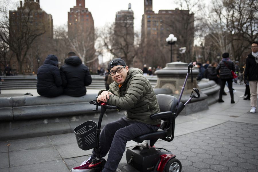 Brian Cheng is a Tisch sophomore, studying Film & TV. He was born with cerebral palsy and had been using a wheelchair to help him move around his entire life. For Cheng, navigating NYU's Washington Square campus can be challenging when it comes to older buildings with worse wheelchair accessibility. (Photo by Katie Peurrung)