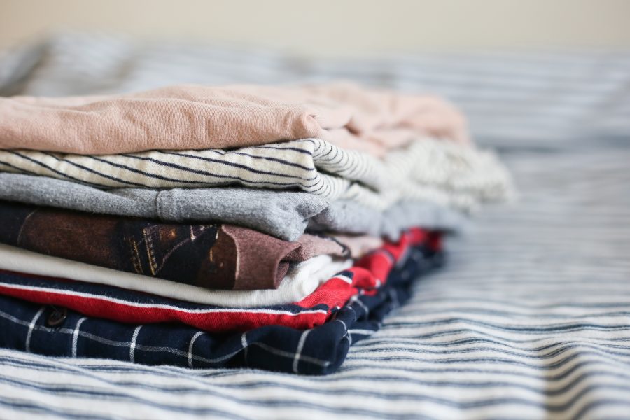 A pile of folded clothing, ready to be donated. (Staff Photo by Julia McNeill)