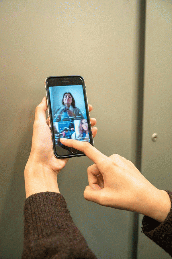A student swipes through the IGTV home. (Photo Illustration by Alana Beyer)  