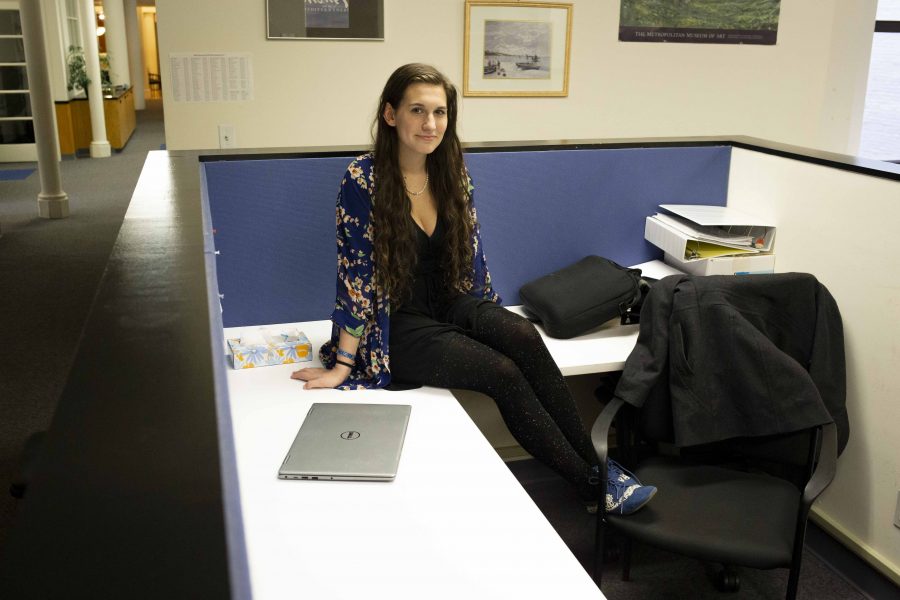 Arbacher sits at her desk in the NYU Writing Center where she edits paper for fellow students. This on-campus job, in addition to tutoring students in music theory and money she saved up over the summer, helps her pay for her living expenses. (Photo by Katie Peurrung)
