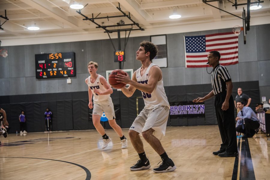 CAS first-year Alex Casieri sets up for a 3-pointer during a game in December. (Photo by Sam Klein)