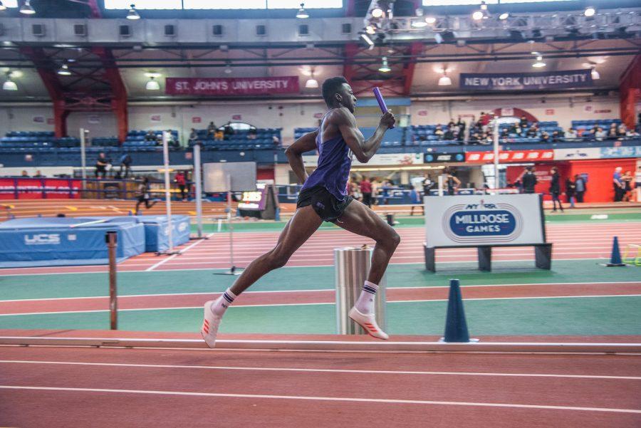 SPS+senior+Malcolm+Montilus+runs+a+4x400-meter+relay+in+January.+Montilus+qualified+for+NCAA+Division+III+nationals.+%28Photo+by+Sam+Klein%29