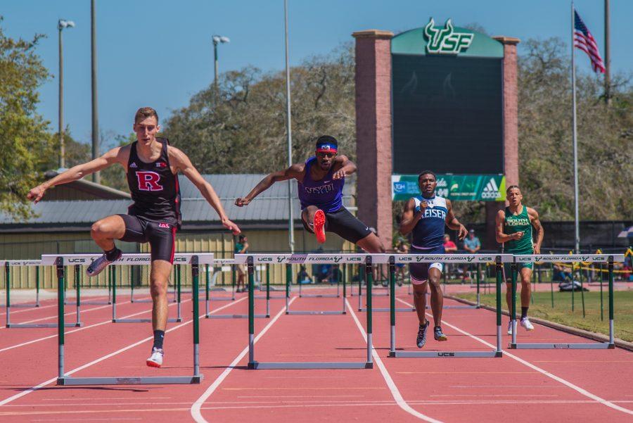 SPS junior Julian Montilus runs the 400m hurdles at the USF Bulls Invitational on Saturday. He placed sixth overall in the event. (Photo by Sam Klein)