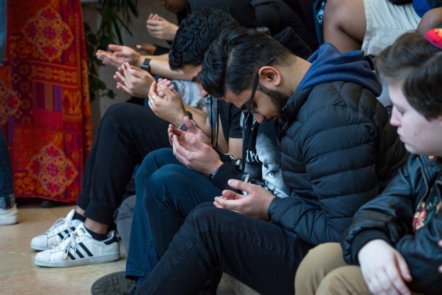 Students participate in a prayer led by Khalid Latif. (Photo by Alana Beyer)