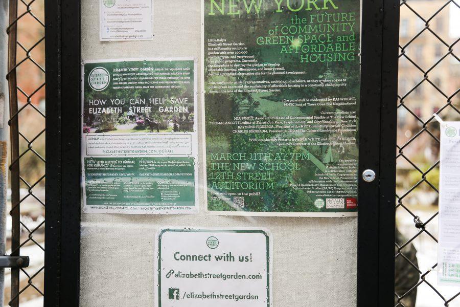Signs outside the garden encourage residents to take action to save the garden. (Staff Photo by Julia McNeill)