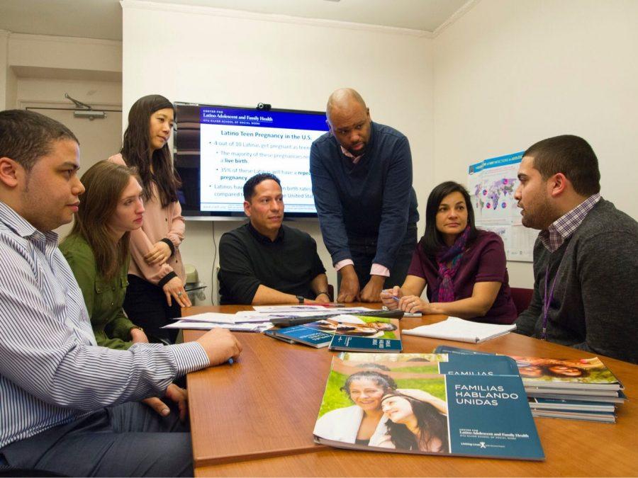 Guilamo-Ramos and his team at the Center for Latino Adolescent and Family Health discuss the Families Talking Together Program. (Courtesy of Dr. Vincent Guilamo Ramos)