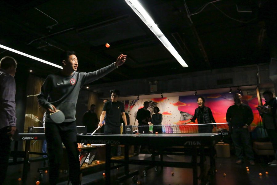 Former table tennis Olympian and SPS junior Tom Feng serves to one of his many futile challengers at Spin New York, the table tennis bar where he works. Beyond participating in the 2016 Olympics, Feng was the top-ranked U.S. men’s player, played professionally in Austria and led NYU to its first national championship in 2018. (Photo by Julia McNeill)