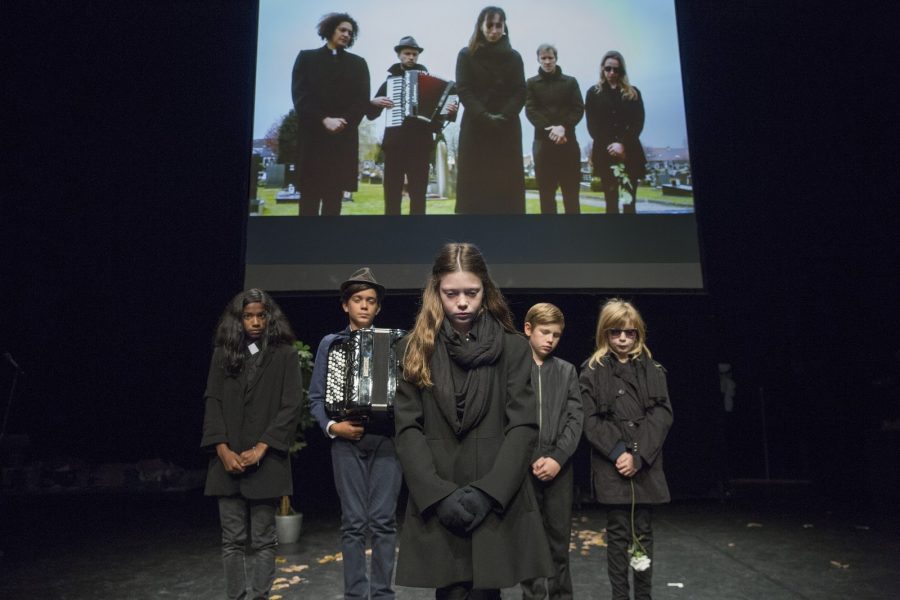 Children mourning a young girl’s murder in “Five Easy Pieces.” In the show, which ran this past weekend at Skirball, children confront real-world trauma. (Courtesy of Skirball)
