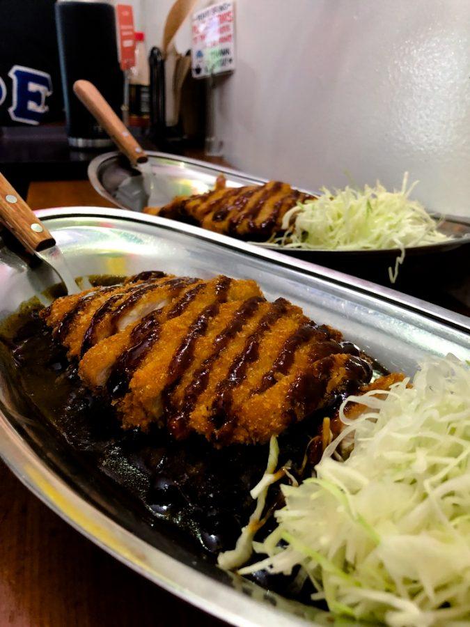 Pork+katsu+over+curry+and+rice+with+a+side+of+shredded+lettuce+from+Go%21+Go%21+Curry.+%28Staff+photo+by+Arin+Garland%29