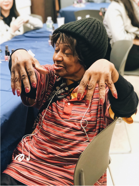 A woman shows off her new manicure. (Photo by Prianka Devi Koya)