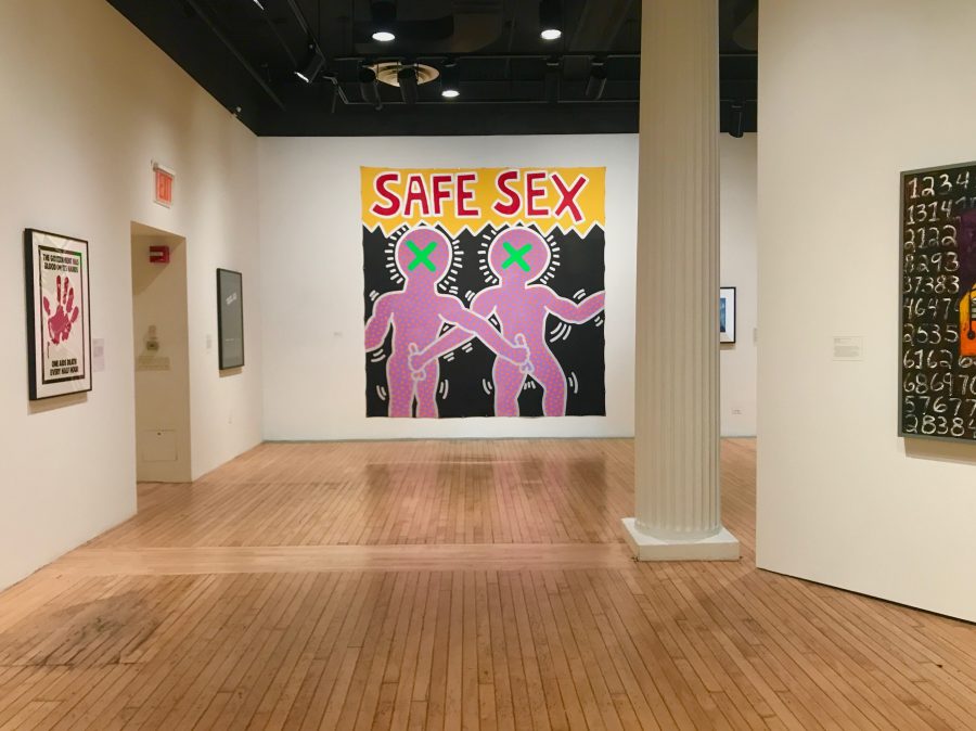 “Safe Sex” (1985) by Keith Haring, included in “Art After Stonewall: 1969-1989” at the Grey Art Gallery. The exhibit, part of which is also on view at the Leslie-Lohman Museum of Gay and Lesbian Art, includes many works that address the AIDS crisis and the Reagan administration’s inaction. (Alana Beyer)