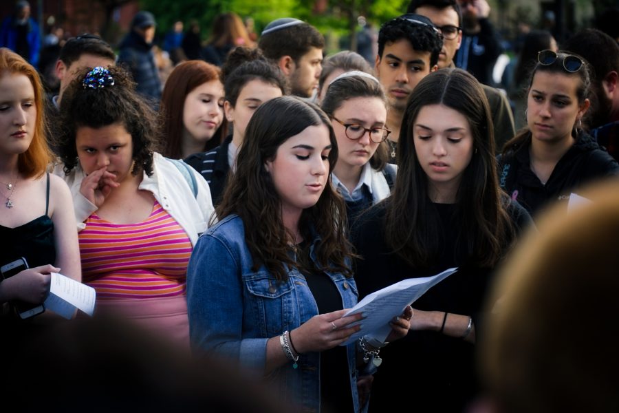 A student speaks at the vigil on Tuesday to commemorate and mourn the victims of Saturday's Poway Synagogue shooting. (Photo by Min Ji Kim)