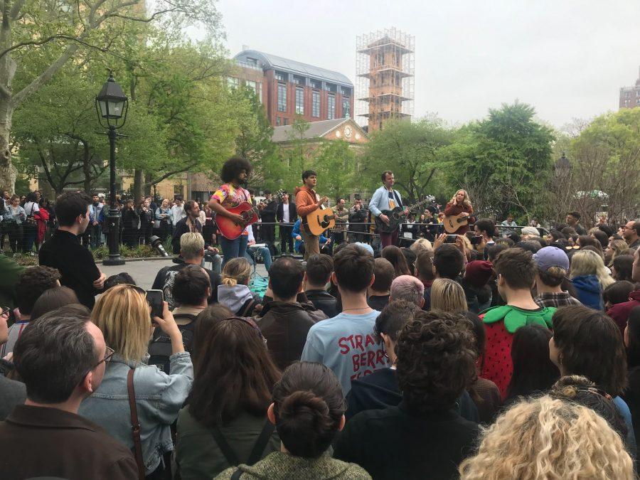 Left to right: guitarist Brian Robert Jones, Ezra Koenig, Chris Baio and touring guitarist Greta Morgan, of Vampire Weekend. The band played an impromptu acoustic show in Washington Square Park on the release day of their new album "Father of the Bride." (Staff photo by Katie Peurrung)