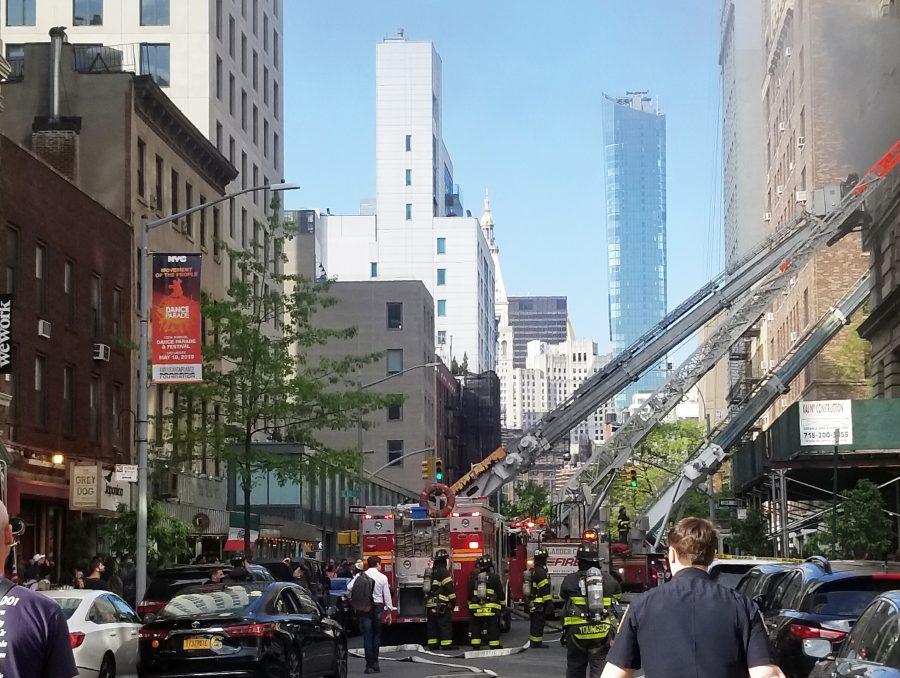 A fire has broken out in a building on East 12th Street and University Place. (Staff Photo by Min Ji Kim)