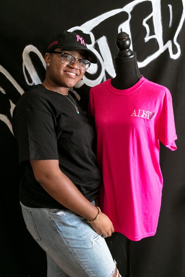 Steinhardt sophomore Ashley Hart poses with merchandise from her hairstyling business, based out of her Brooklyn apartment. (Staff Photo by Marva Shi)