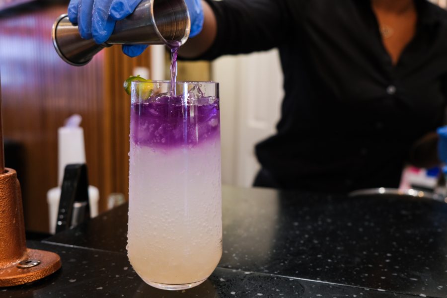 Majestic Butterfly, a special drink with Butterfly Pea infused into premium Gin and Tonic and a squeeze of Lime. It changes color from blue to purple to pink right before your eyes. (Staff Photo by Elaine Chen)