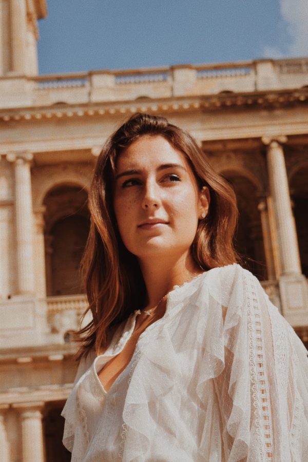 Ella Haines in white at Saint-Sulpice.