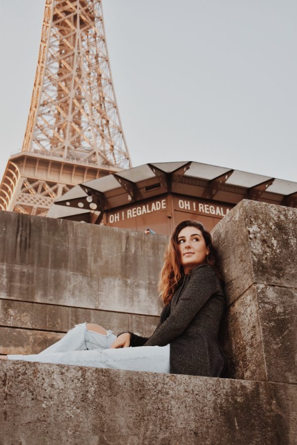 Ella Haines under the Eiffel Tower.