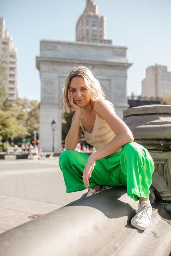 First-year+Gallatin+student+and+YouTuber+Lucy+McFadin+poses+at+Washington+Square+Park.+%28Photo+by+Taylor+Krase%29