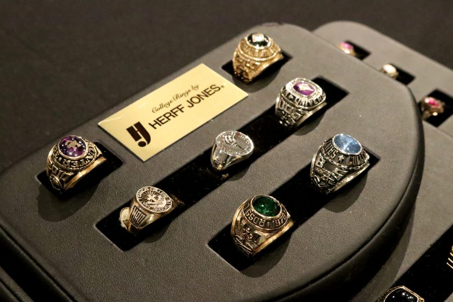NYU class rings are displayed in the NYU Bookstore. Each one retails for around $400. (Photo by Talia Rose Barton)