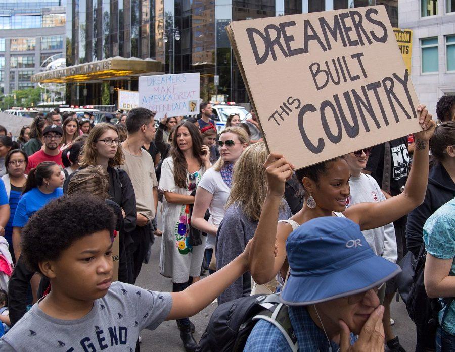 People speak out in support of DACA in New York City. (Via Wikimedia)