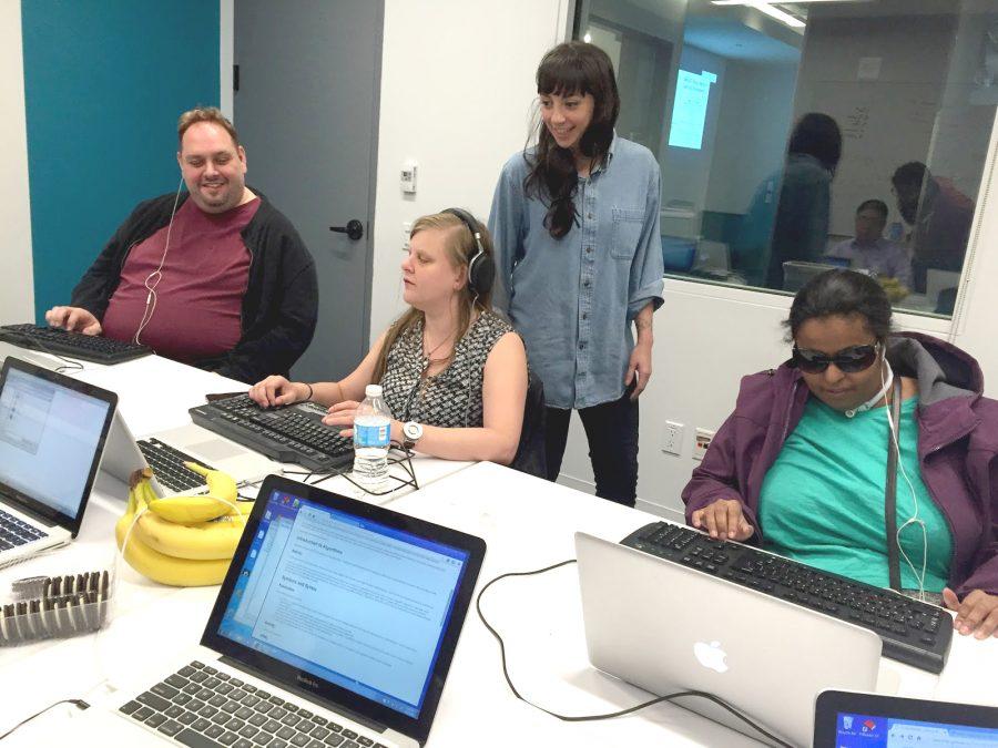 Claire Kearney-Volpe watches over three participants in her web development workshop for the visually impaired. In this study, she monitors the use of screenreaders to create P5.js sketches. (Courtesy of The Processing Foundation)