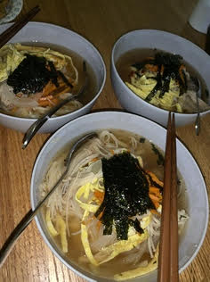 Three bowls of homemade Korean party noodles are ready to be eaten. This traditional Korean dish, Janchi guksu, is typically served at celebratory events such as weddings and birthdays. (Photo by Ju Hee Shin)
