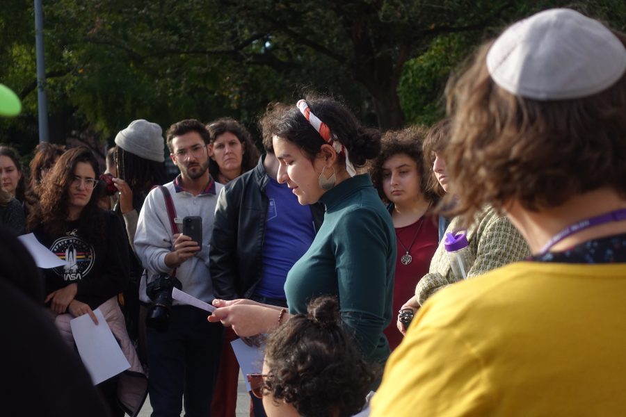  Nicole Beremovica a CAS sophomore who was raised in Dusseldorf, Germany, speaks at a vigil honoring the victims of a Yom Kippur attack in Halle, Germany. (Staff Photo by Min Ji Kim)