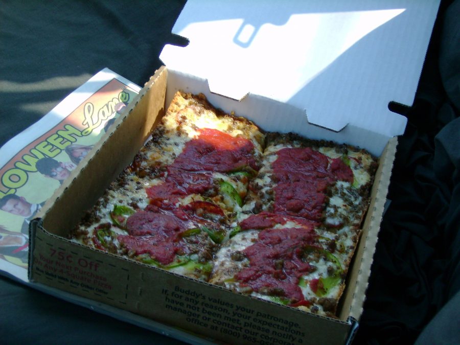Detroit-style pizza is typically served in rectangular slices with a thick crust. Now, students can enjoy slices of Detroit-style pizza in the city at Lions & Tigers & Squares. (Via Wikimedia Filmgod)