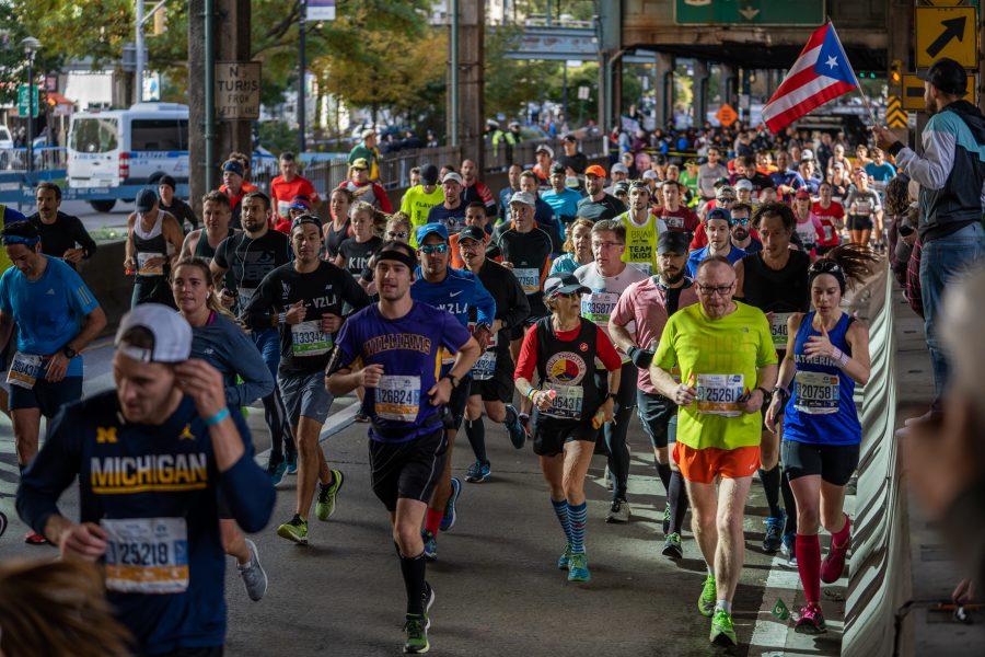 Runners race through Queens as part of the 2019 New York City Marathon. (Photo by Tomer Keysar)