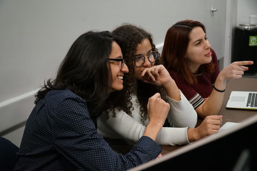 Carlos (left) and two other members of NYU Cabaret laugh after hearing an audition. Up until the beginning of last year, he wanted to be an actor and loves to perform. (Photo by Min Ji Kim)