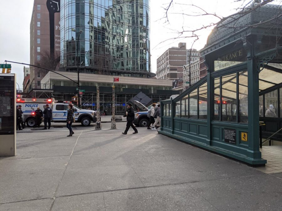 Emergency vehicles, police officers, and paramedics surrounded Astor Place. A train struck an individual at Astor Place Station. (Staff Photo by Nick Mead)