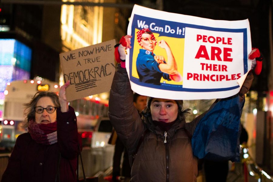 Protestors march down 5th Avenue in response to the State of the Union and the Senate Acquittal of President Trump. (Staff photo by Jake Capriotti)