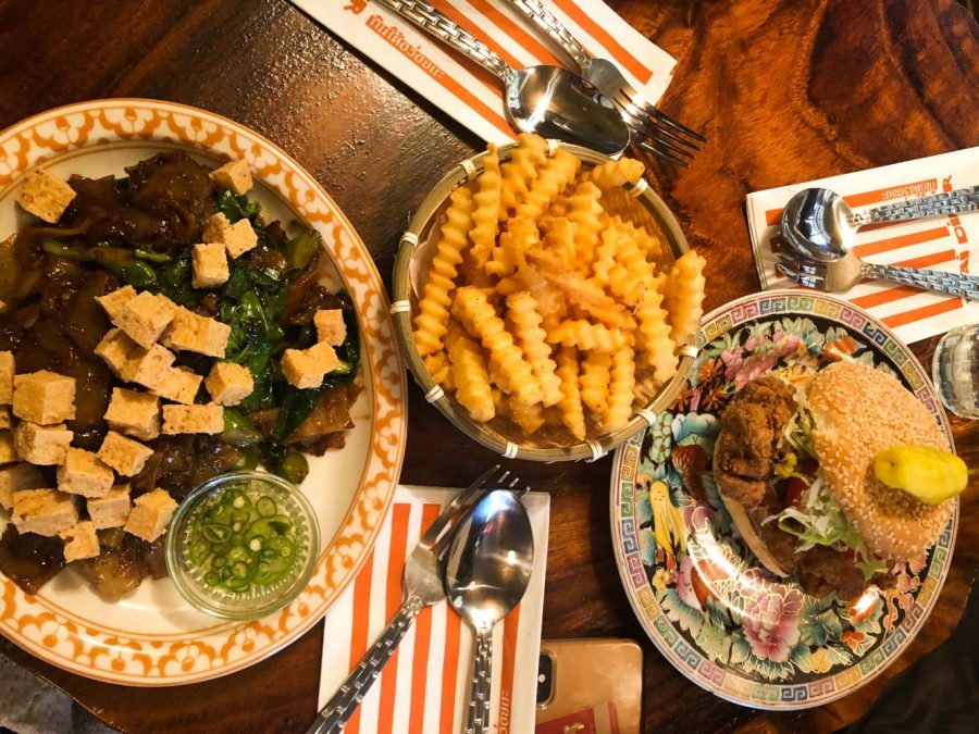 The Fried Chicken Sandwich and Phat See Eiw are both served by Uncle Boons. This new Asian-fusion restaurant is located in Little Italy. (Photo by Ria Mittal)