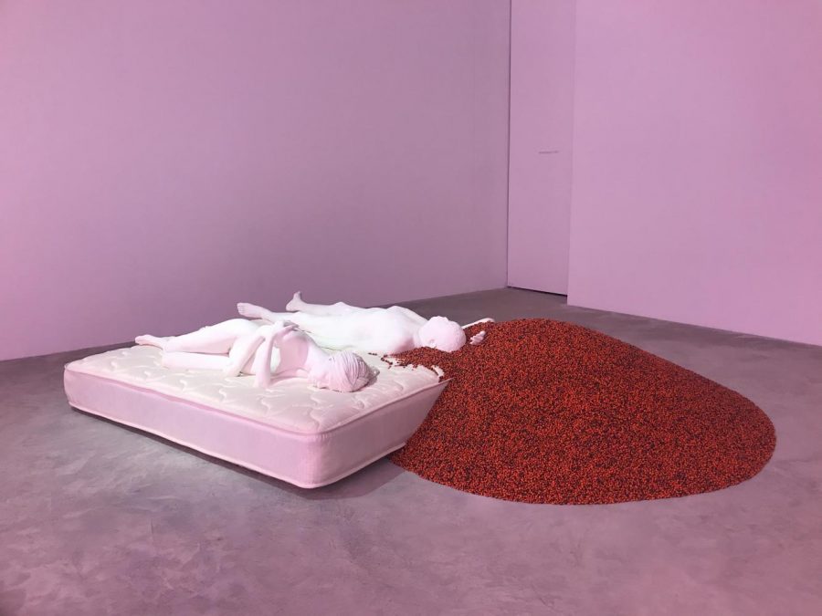 Ai+Weiwei%E2%80%99s+piece%2C+Two+Figures%2C+is+a+life-size+work+of+a+plaster-cast+man+and+wife+lying+on+a+mattress%2C+with+a+pile+of+red+seeds+surrounding+the+man%E2%80%99s+head.+This+was+used+as+a+reference+to+the+Tang+Dynasty+poem%2C+Love+Seeds%2C+which+inspired+the+title+of+the+exhibit.+%28Photo+by+Alexandra+Bentzien%29