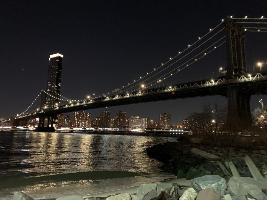 The Brooklyn Bridge shines brightly in the night. Since leaving the city when remote learning began, many students are thinking of their experiences in the city, such as witnessing views such as these. (Photo by Manasa Gudavalli)