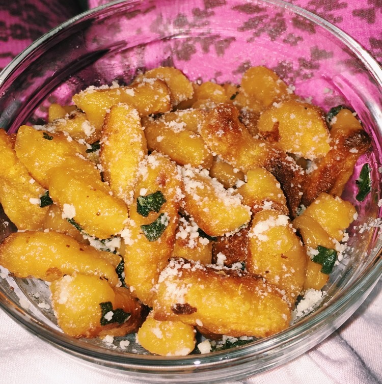 Deputy Culture Editor Addison Aloian makes her sweet potato gnocchi recipe, topping it with sage, paprika, and cheese. Spending time in quarantine has allowed her to hone in on hobbies such as cooking. (Staff Photo by Addison Aloian)