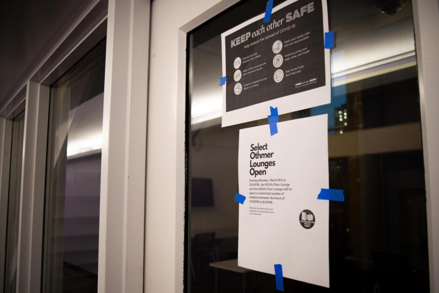 COVID+policy+signs+are+taped+on+the+door+of++Brooklyn+dorm+Othmer+Hall%E2%80%99s+lounge.+NYU+dorm+lounges+are+reopening+across+campus+and+many+are+worried+about+the+increased+risk+of+COVID-19+spread.+%28Staff+Photo+by+Jake+Capriotti%29