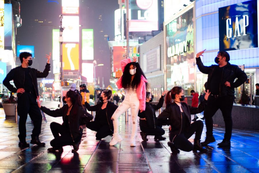 Harmonyc Movement poses in Times Square  for the thumbnail of their cover of HyunA’s I’m Not Cool. K-pop dance groups have managed to find ways to continue to develop their community and create content during the COVID-19 pandemic. (Staff Photo by Jake Capriotti)
