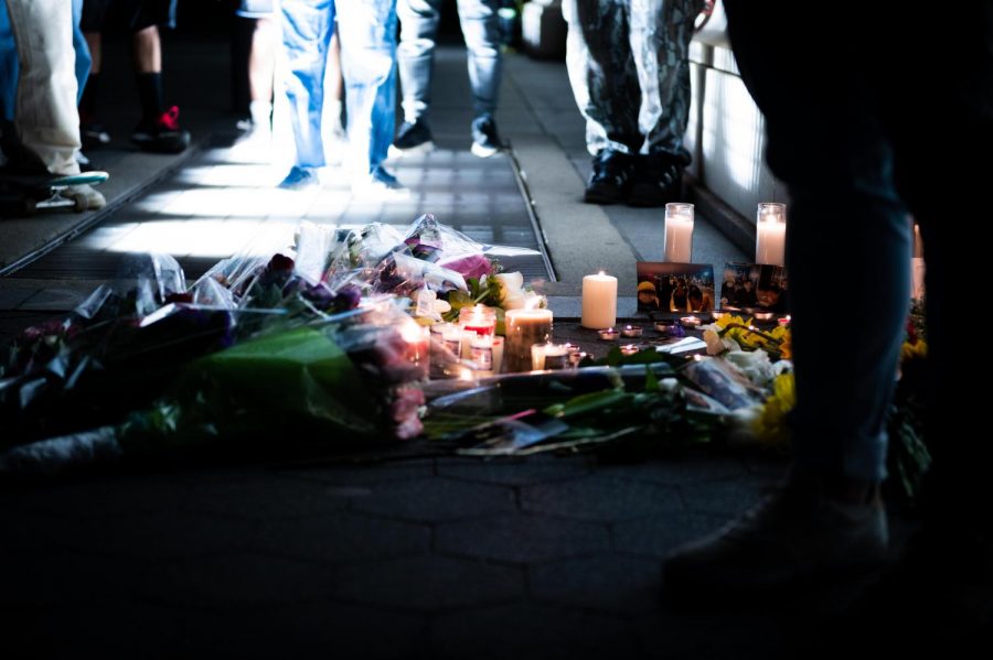 Students lit candles and left flowers in memory of Farbin Towhid. (Staff Photo by Jake Capriotti)