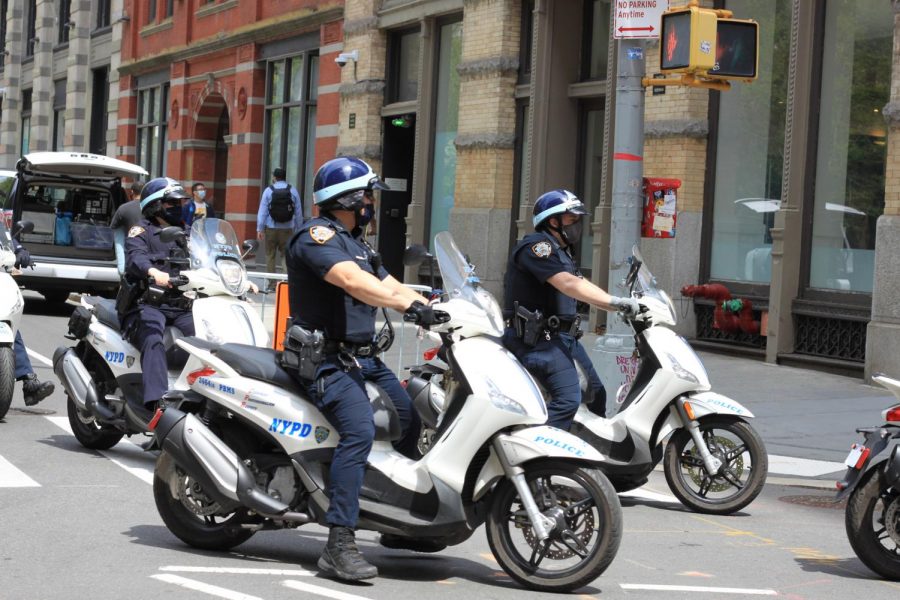 Police+officers+ride+by+Bobst.+Mayoral+candidate+Andrew+Yangs+policies+do+nothing+to+curb+the+issue+of+police+power+in+New+York+City.+%28Staff+Photo+by+Alexandra+Chan%29