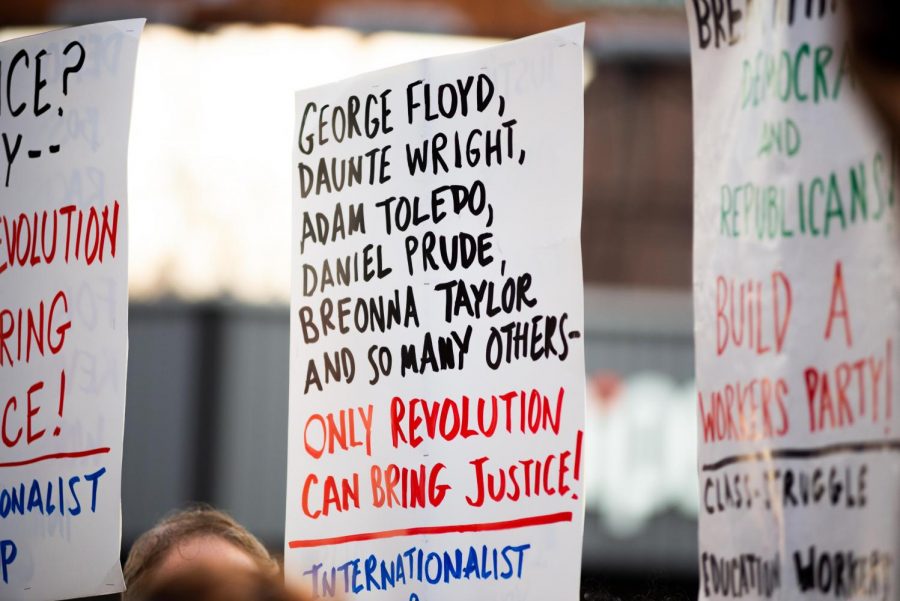 A poster hangs in the balance that mentions the names of the people of color killed by police departments across the U.S. This highlights the ongoing issue of police brutality and how it affects residents of color. (Staff Photo by Jake Capriotti)