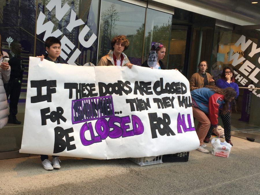 This is an image of NYU students' Incarceration to Education Coalition protest during 2017 Weekend on the Square. Since then, the university still has not shown coordinated effort dedicated to documenting its ties to chattel slavery, including the history of enslaved and more recently wrongly incarcerated people on campus grounds. (Photo by Natasha Roy)
